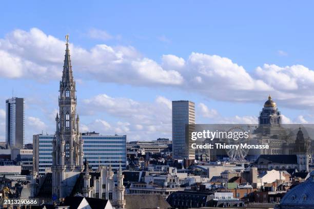 The tower of the historic Brussels town hall, the Tour Blaton, the Brussels Giant Wheel and the Palace of Justice of Brussels are seen from the Roof...