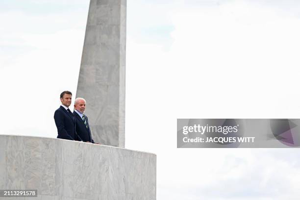 France's President Emmanuel Macron and Brazil's President Luiz Inacio Lula da Silva look on after a bilateral meeting at the Planalto Palace in...