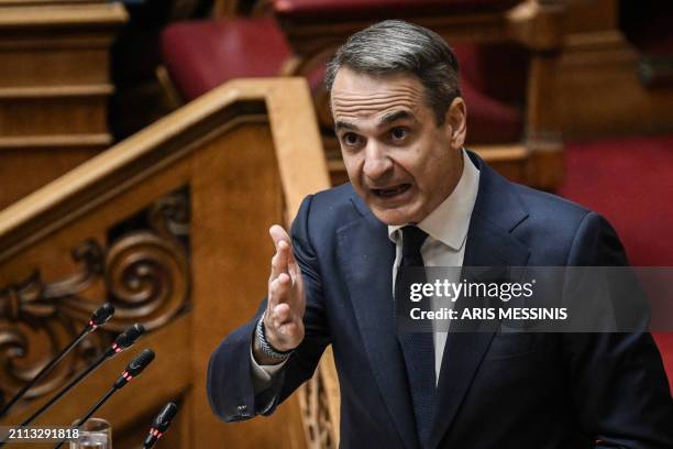 Greek Prime Minister Kyriakos Mitsotakis addresses lawmakers at parliament, ahead of a vote on confidence following a motion of censure submitted by...