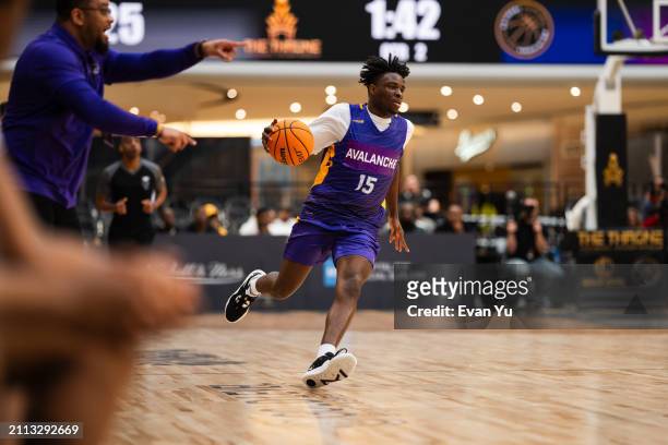 Emmanuel Joe Samuel of Camden Avalanche dribbles the ball during the game against the Ridge View Blazers during The Throne high school basketball...