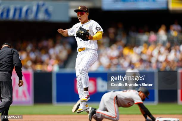 Ha-Seong Kim of the San Diego Padres reacts after a play at second base in the third inning during an Opening Day game against the San Francisco...