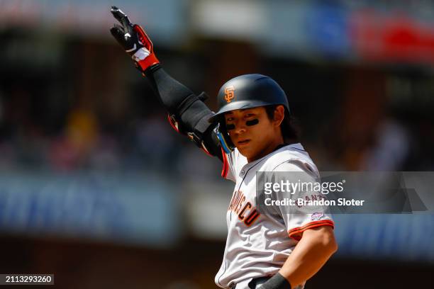 Jung Hoo Lee of the San Francisco Giants gestures after hitting a single in the fifth inning during an Opening Day game against the San Diego Padres...