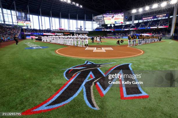 Teams line the base paths prior to the game between the Pittsburgh Pirates and the Miami Marlins at loanDepot park on Thursday, March 28, 2024 in...