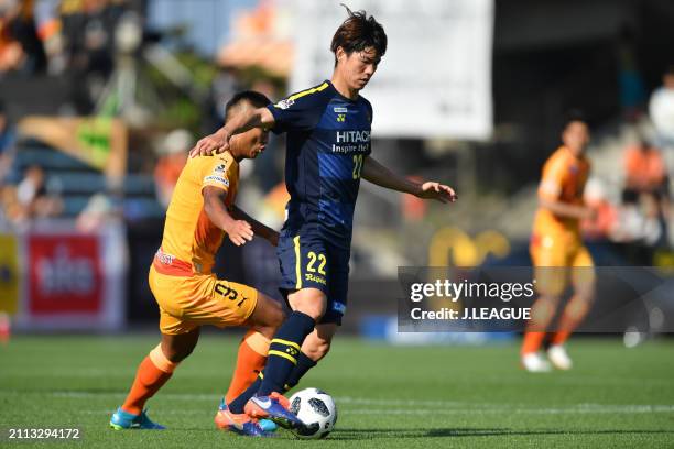 Park Jeong-su of Kashiwa Reysol controls the ball against Jong Tae-se of Shimizu S-Pulse during the J.League J1 match between Shimizu S-Pulse and...