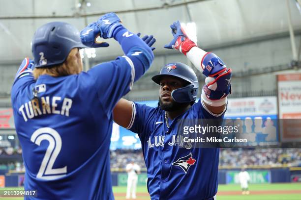 Justin Turner and Vladimir Guerrero Jr. #27 of the Toronto Blue Jays celebrate after Guerrero Jr.'s solo home run in the sixth inning of the game...