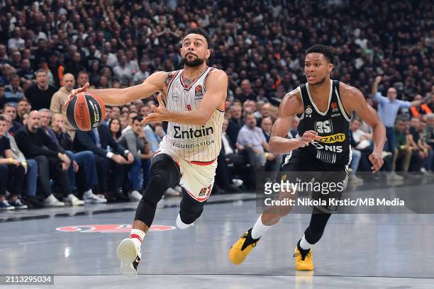 Nigel William-Goss of Olympiacos Piraeus competes against Perry Dozie JR of Partizan Mozzart Bet Belgrade during the 2023/2024 Turkish Airlines...