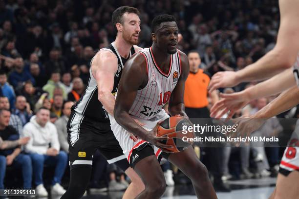 Frank Kaminsky of Partizan Mozzart Bet Belgrade competes against Moustapha Fall of Olympiacos Piraeus during the 2023/2024 Turkish Airlines...