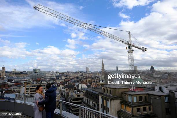 People enjoy the view from rooftop of the 'Brucity' the new building of Brussels administration, on March 28, 2024 in Brussels, Belgium. The tower,...