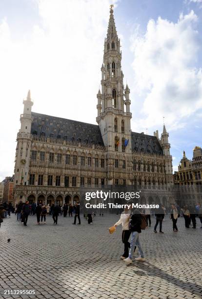 The historical Brussels Town Hall with the famous arrow is seen from the 'Grand-Place' on March 28, 2024 in Brussels, Belgium. The tower is topped by...