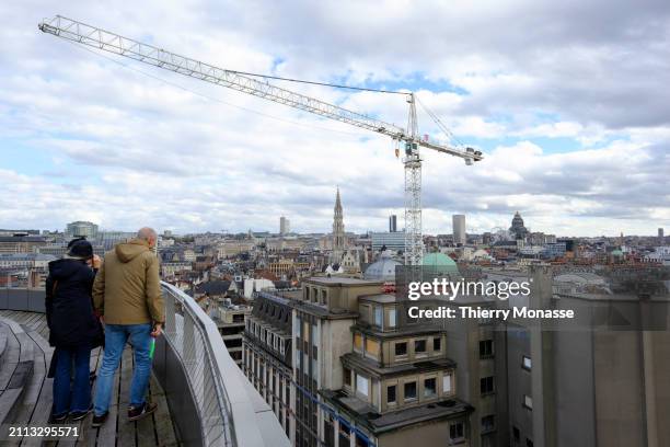 People enjoy the view from rooftop of the 'Brucity' the new building of Brussels administration, on March 28, 2024 in Brussels, Belgium. The tower,...