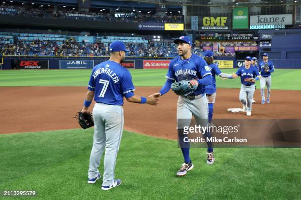 Isiah Kiner-Falefa and George Springer of the Toronto Blue Jays celebrate after winning the game between the Toronto Blue Jays and the Tampa Bay Rays...