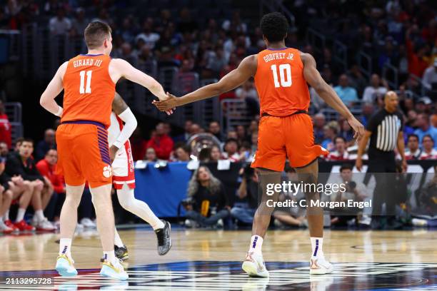 Joseph Girard III of the Clemson Tigers and RJ Godfrey of the Clemson Tigers celebrate during the Sweet Sixteen round of the 2024 NCAA Men's...