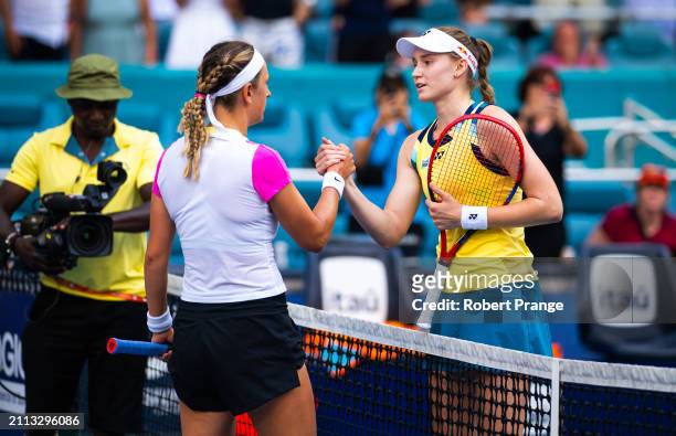 Elena Rybakina of Kazakhstan and Victoria Azarenka shake hands at the net after the semi-final on Day 13 of the Miami Open Presented by Itau at Hard...