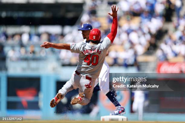 Willson Contreras of the St. Louis Cardinals slides into second base in the fourth inning during the game between the St. Louis Cardinals and the Los...