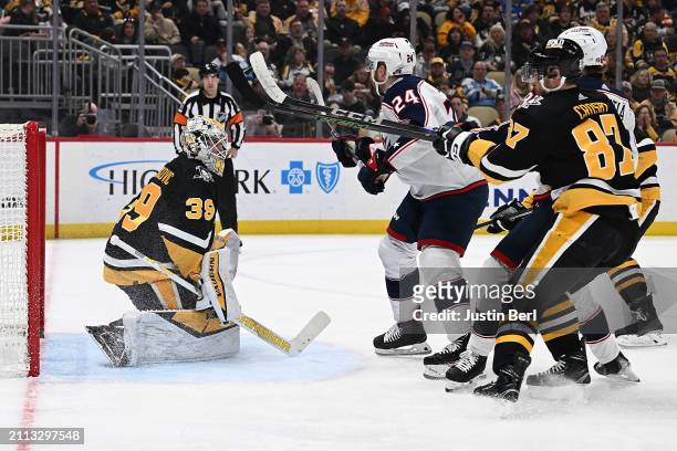 Mathieu Olivier of the Columbus Blue Jackets scores a goal past Alex Nedeljkovic of the Pittsburgh Penguins in the second period during the game at...