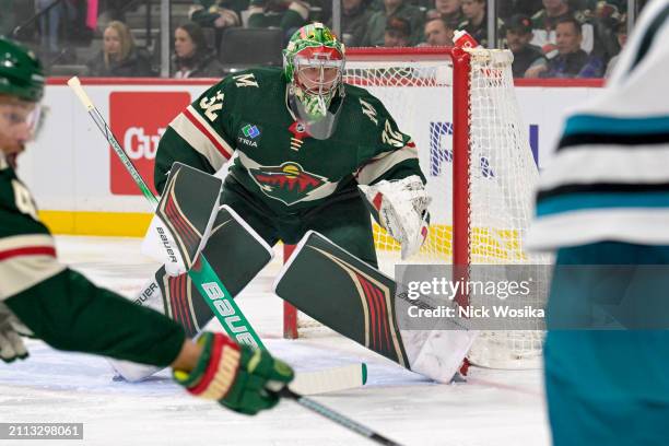 Filip Gustavsson of the Minnesota Wild tracks the puck against the San Jose Sharks during the first period at Excel Energy Center on March 28, 2024...