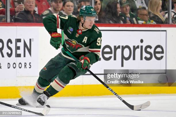 Kirill Kaprizov of the Minnesota Wild controls the puck against the San Jose Sharks during the second period at Excel Energy Center on March 28, 2024...