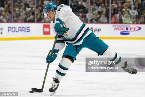 Mike Hoffman of the San Jose Sharks takes a shot on goal against the Minnesota Wild during the third period at Excel Energy Center on March 28, 2024...