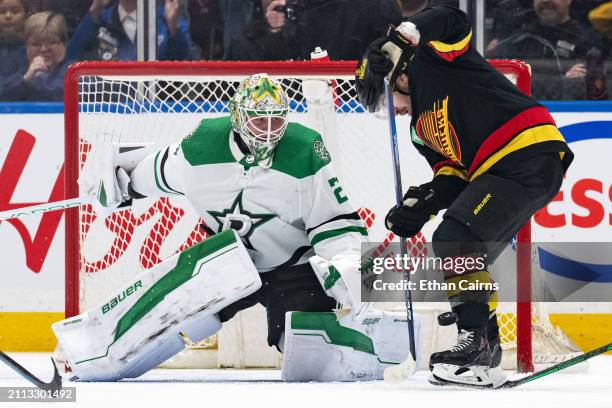 Conor Garland of the Vancouver Canucks shoots against Jake Oettinger of the Dallas Stars in the second period at Rogers Arena on March 28, 2024 in...