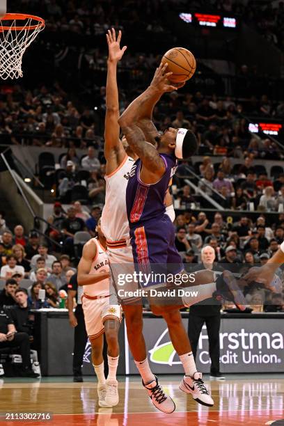 Bradley Beal of the Phoenix Suns drives to the basket during the game against the San Antonio Spurs on March 25, 2024 at the AT&T Center in San...