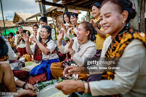 Local women dressed up in traditional dress from Surin, in...