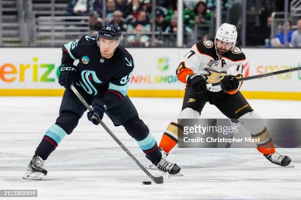 Andre Burakovsky of the Seattle Kraken skates with the puck during the third period of a game against the Anaheim Ducks at Climate Pledge Arena on...