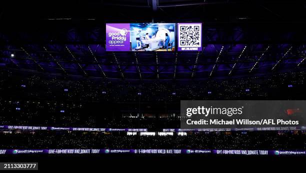 The Shine a Light activation is seen during the 2024 AFL Round 03 match between the North Melbourne Kangaroos and the Carlton Blues at Marvel Stadium...