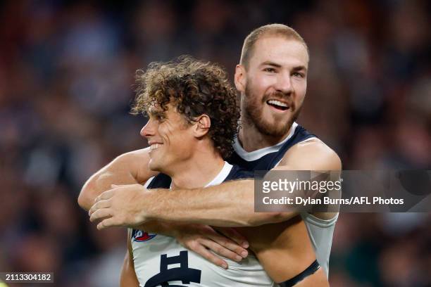 Charlie Curnow of the Blues celebrates a goal with teammate Harry McKay during the 2024 AFL Round 03 match between the North Melbourne Kangaroos and...