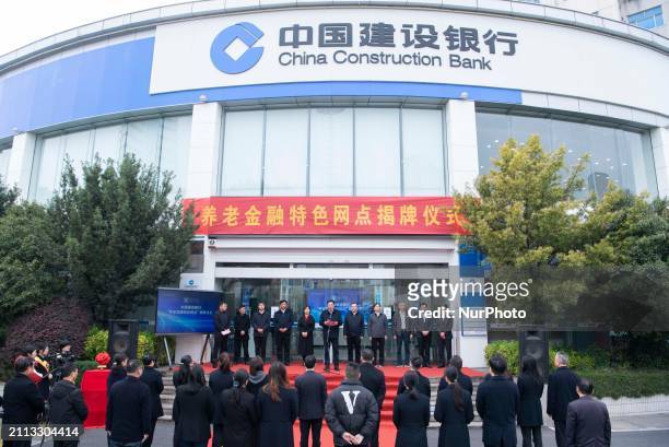 The opening ceremony of China Construction Bank's pension finance outlet is taking place in Hai'an, Jiangsu Province, China, on March 28, 2024.