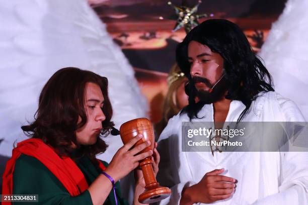 People are reenacting the Passion of Christ, which includes the scene of the washing of the feet, as part of the 181st representation of the Passion,...