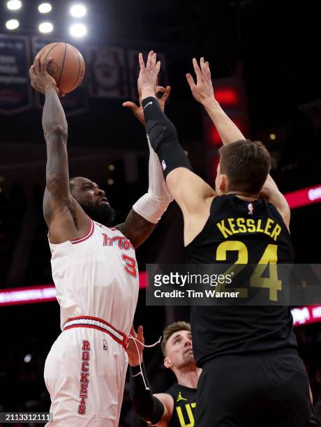 Jeff Green of the Houston Rockets shoots the ball while defended by Walker Kessler of the Utah Jazz in the first half at Toyota Center on March 23,...