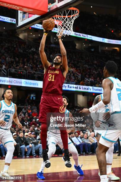 Jarrett Allen of the Cleveland Cavaliers lays up a shot in the first quarter against the Charlotte Hornets at Rocket Mortgage Fieldhouse on March 25,...