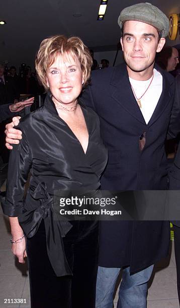 British singer Robbie Williams with his mother at the premiere of Nobody Someday at the Warner cinema, Shepherds Bush, London on November 6, 2001....