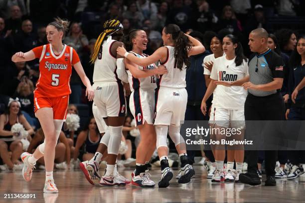Ashlynn Shade celebrates with the Connecticut Huskies during the second half of a second round NCAA Women's Basketball Tournament game against the...