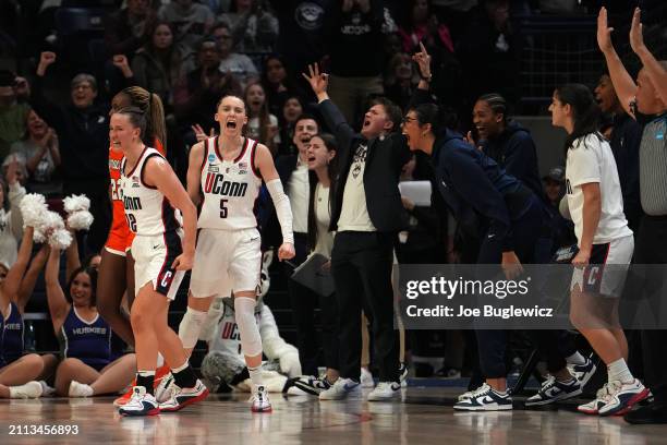 Ashlynn Shade and Paige Bueckers of the Connecticut Huskies celebrate during the second half of a second round NCAA Women's Basketball Tournament...