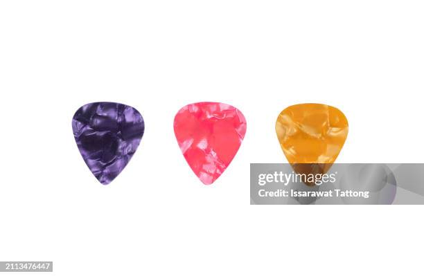 guitar pick isolated on white background - linear-image stock pictures, royalty-free photos & images