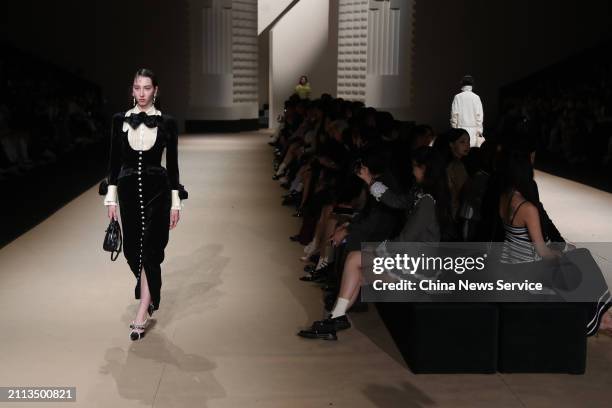 Model walks the runway at Le Fame collection show on day 1 of the 2024 Autumn/Winter Shanghai Fashion Week at Shanghai Xintiandi Taipinghu Park on...