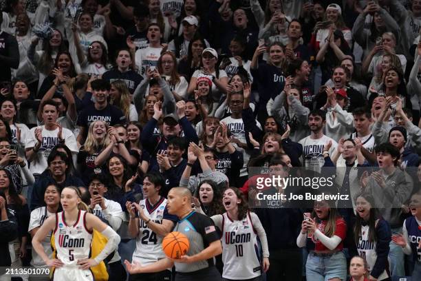 Connecticut Huskies fans cheer during the second half of a second round NCAA Women's Basketball Tournament game against the Syracuse Orange at the...
