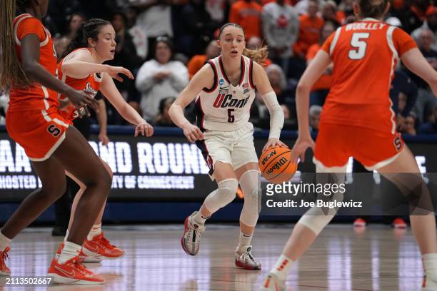 Paige Bueckers of the Connecticut Huskies handles the ball against the Syracuse Orange during the second half of a second round NCAA Women's...
