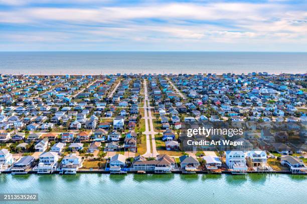 galveston island beachfront neighborhood aerial - texas stock pictures, royalty-free photos & images