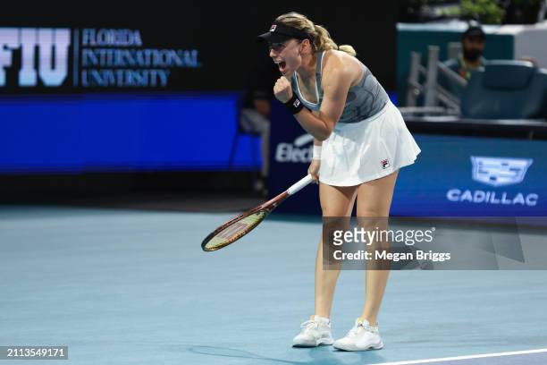 Ekaterina Alexandrova reacts after defeating Iga Swiatek of Poland in their women's singles match during the Miami Open at Hard Rock Stadium on March...