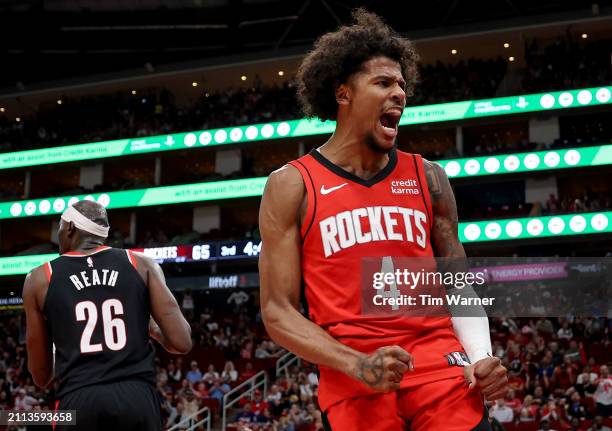 Jalen Green of the Houston Rockets reacts after a dunk in the second half against the Portland Trail Blazers at Toyota Center on March 25, 2024 in...