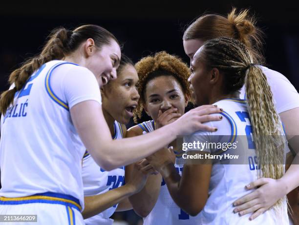 Angela Dugalic, Camryn Brown, Kiki Rice, Lina Sontag and Charisma Osborne of the UCLA Bruins celebrate possession after a timeout in a 67-63 win over...