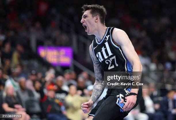 Vit Krejci of the Atlanta Hawks reacts after dunking against the Boston Celtics during the third quarter at State Farm Arena on March 25, 2024 in...