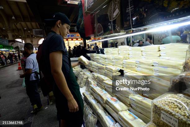 People are searching for fish at the Municipal Market on the eve of Good Friday in Sao Paulo, Brazil, on March 28, 2024.