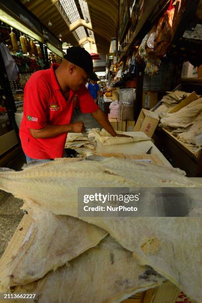 People are searching for fish at the Municipal Market on the eve of Good Friday in Sao Paulo, Brazil, on March 28, 2024.