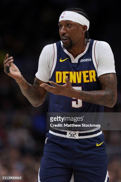 Kentavious Caldwell-Pope of the Denver Nuggets looks for a foul call agaomst the Memphis Grizzlies in the first quarter at Ball Arena on March 25,...