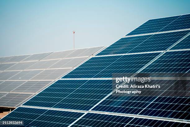 clean energy:  solar panels in sunlight - islamabad stock pictures, royalty-free photos & images