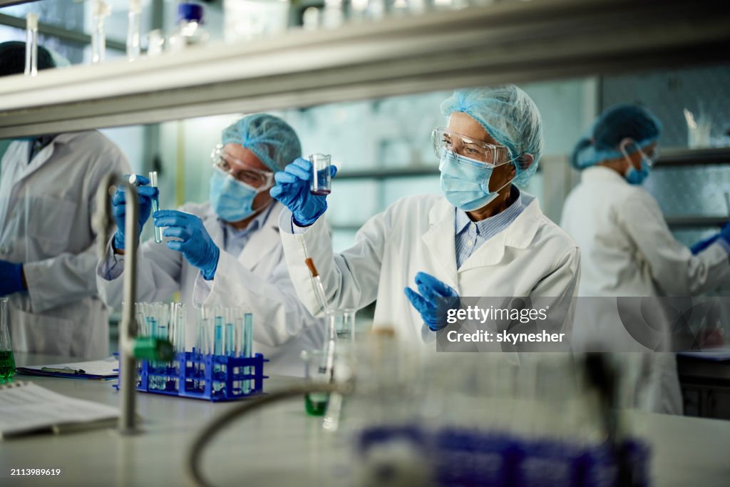 Team of scientists working on a research in laboratory.