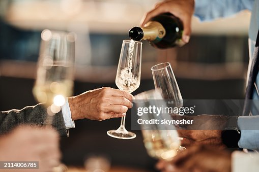 Pouring champagne at office party! Pouring champagne at office party!